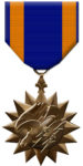This image has an empty alt attribute; its file name is Air_Medal_front-75x150.jpg
